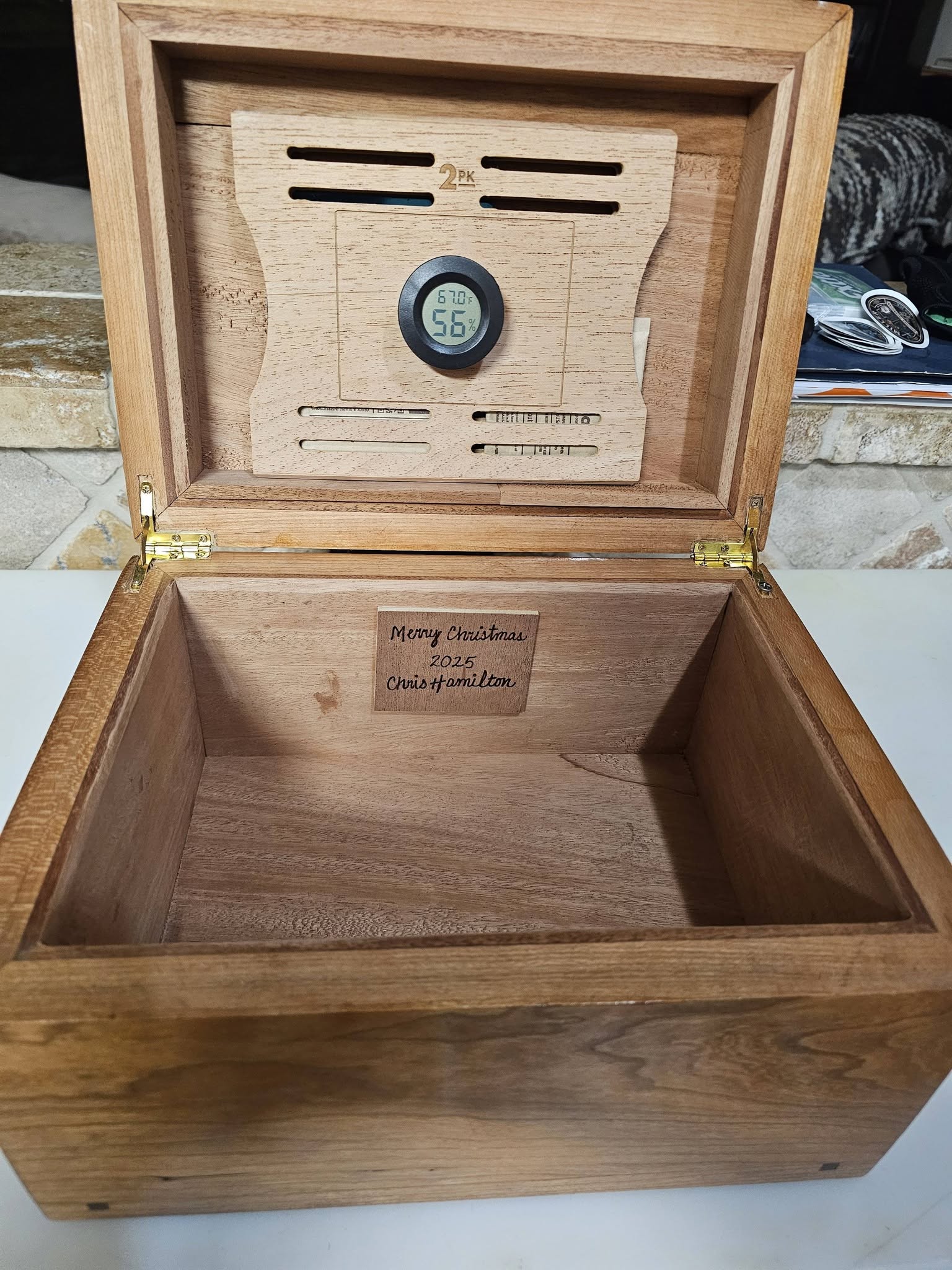 Open wood humidor box personalized with a Merry Christmas 2025 engraving